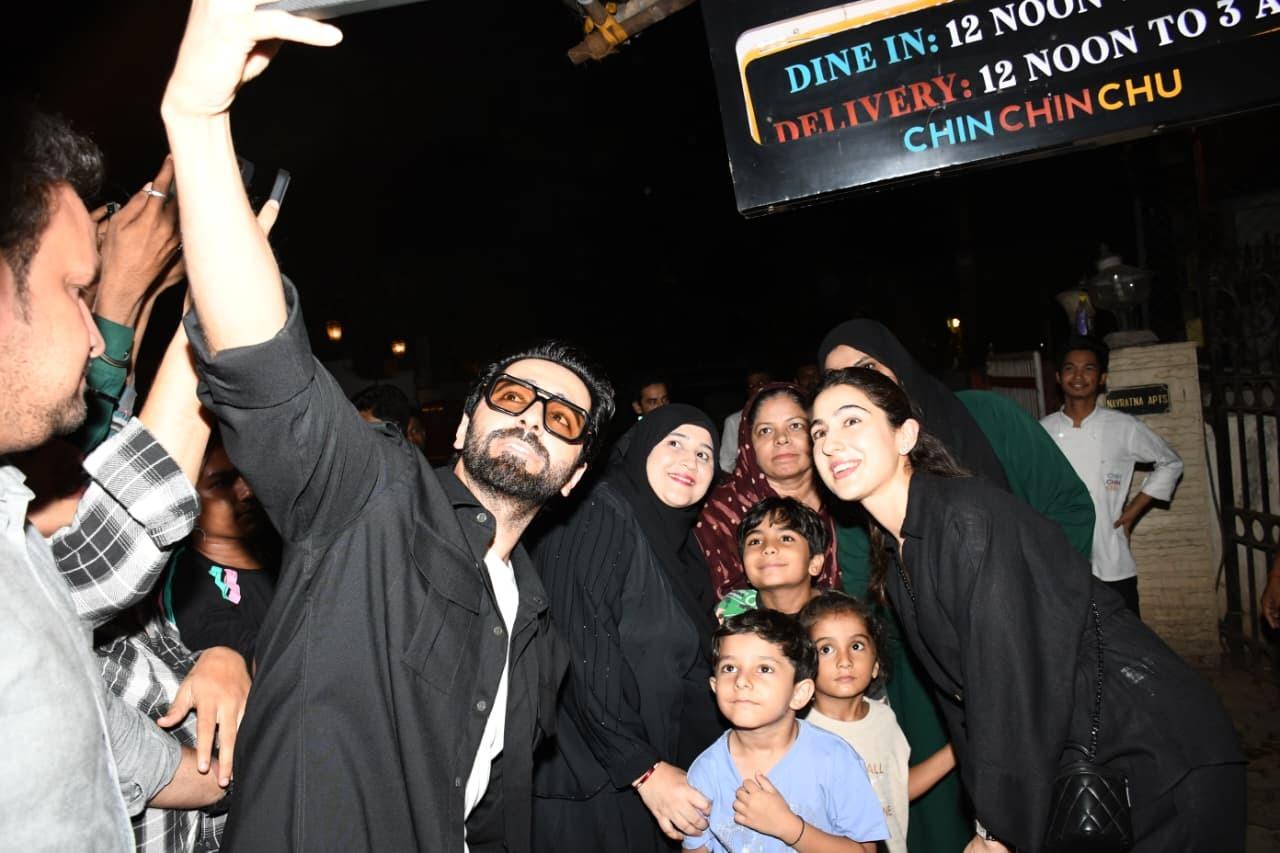 Ayushmann Khurrana and Sara Ali Khan were seen clicking pictures with thier fans outside a restaurant. Ayushmann Khurrana and Sara Ali Khan were seen clicking pictures with thier fans outside a restaurant.